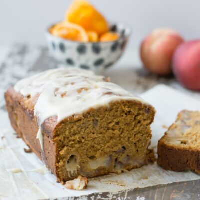 Fluffy peach quick bread with homemade icing.